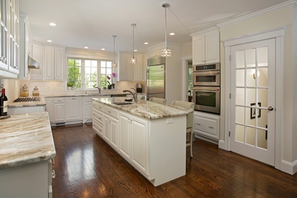 25 Patton Road Wellesley, MA 02482 - Photo 4 of 20 a kitchen with stainless steel appliances granite countertop a sink stove and refrigerator