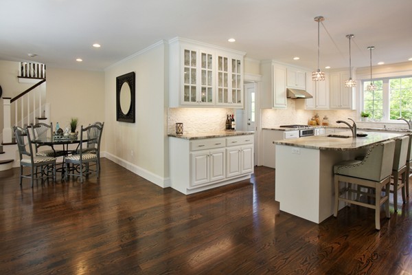 25 Patton Road Wellesley, MA 02482 - Photo 5 of 20 a kitchen with stainless steel appliances granite countertop a stove top oven a sink a dining table and chairs with wooden floor