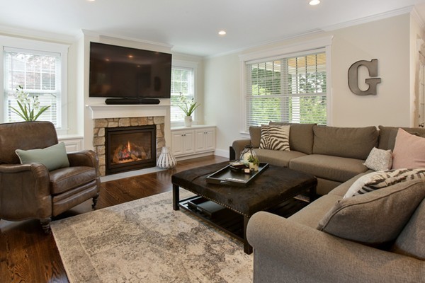 25 Patton Road Wellesley, MA 02482 - Photo 7 of 20 a living room with furniture a flat screen tv and a fireplace
