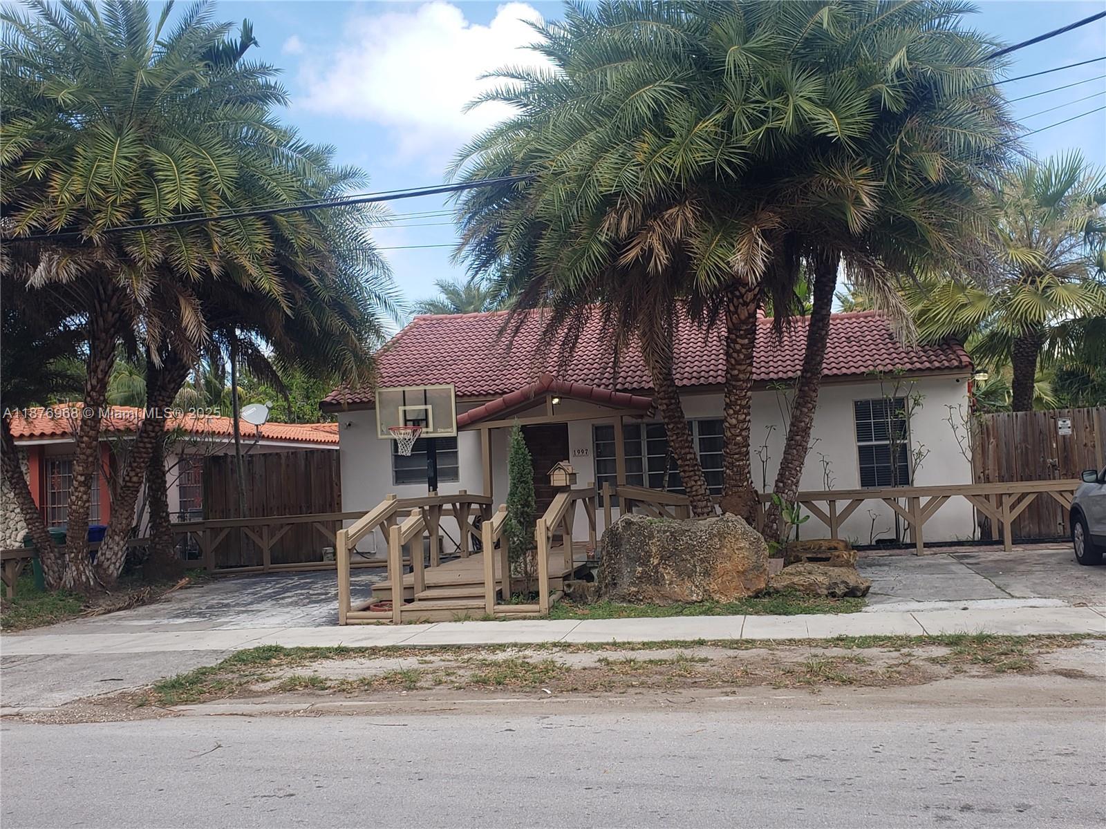 1997 Southwest 17th Court, Unit 2 Miami, FL 33145 - Photo 1 of 6 a front view of a house with garden