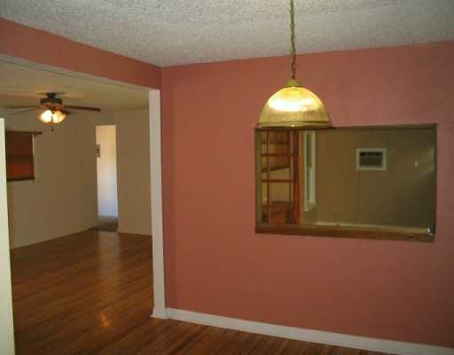 3335 Floyd Street Corpus Christi, TX 78411 - Photo 3 of 8 a view of a livingroom with wooden floor and a window