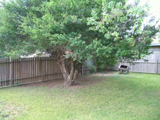 3335 Floyd Street Corpus Christi, TX 78411 - Photo 6 of 8 a backyard of a house with trees