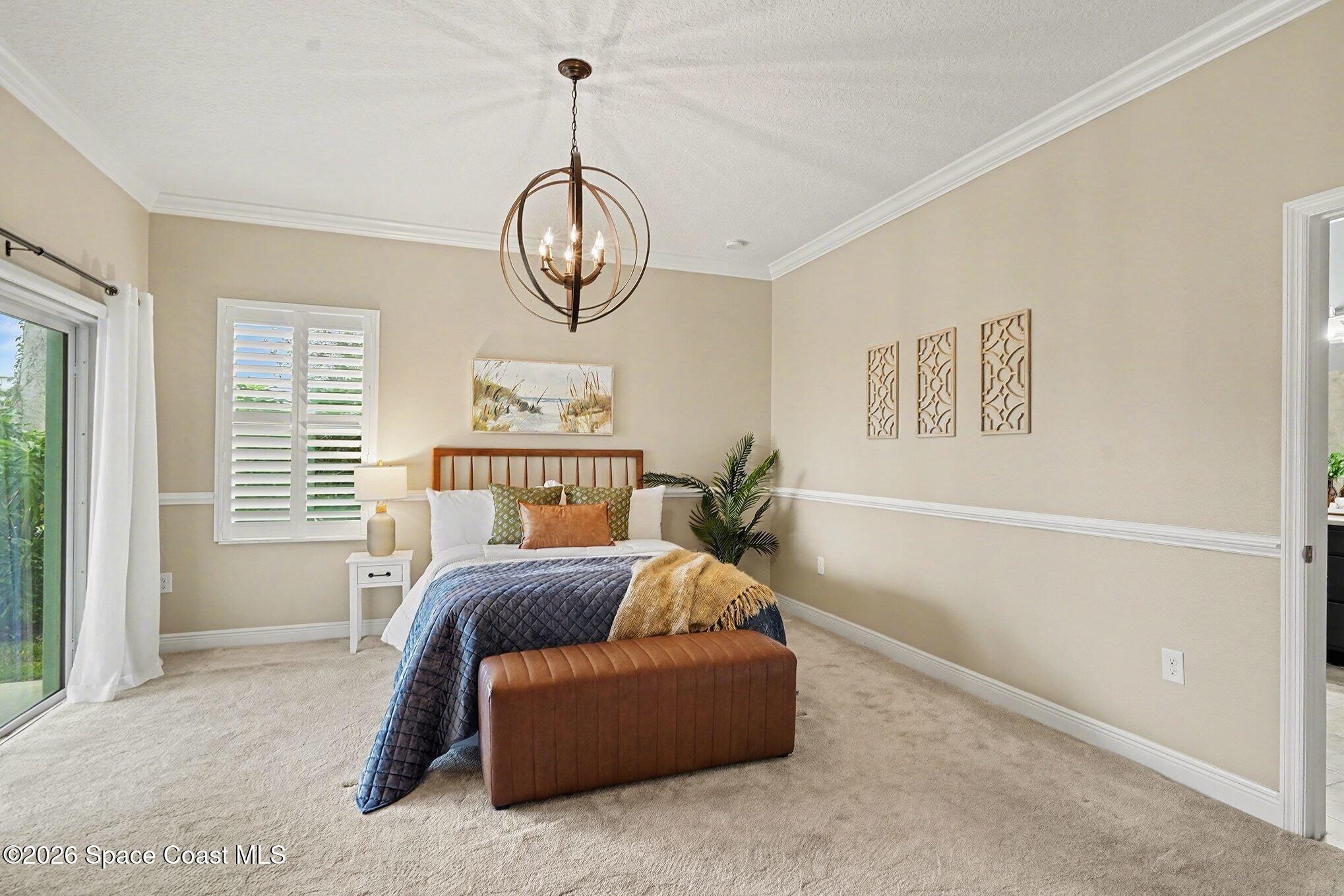 4310 Alamanda Key Drive Melbourne, FL 32901 - Photo 13 of 43 a spacious bedroom with bed and a window