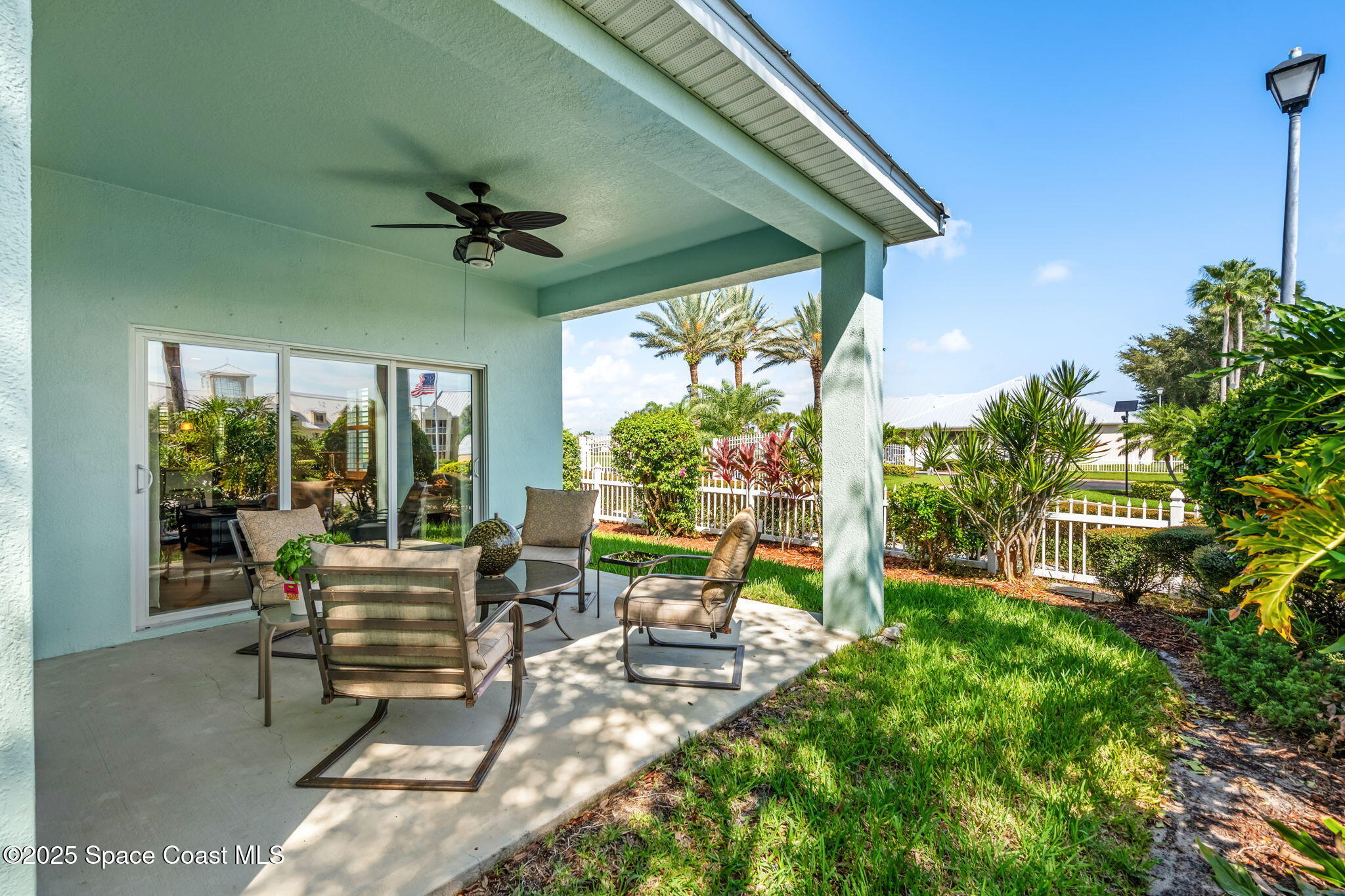 4310 Alamanda Key Drive Melbourne, FL 32901 - Photo 24 of 43 a balcony with furniture and a garden