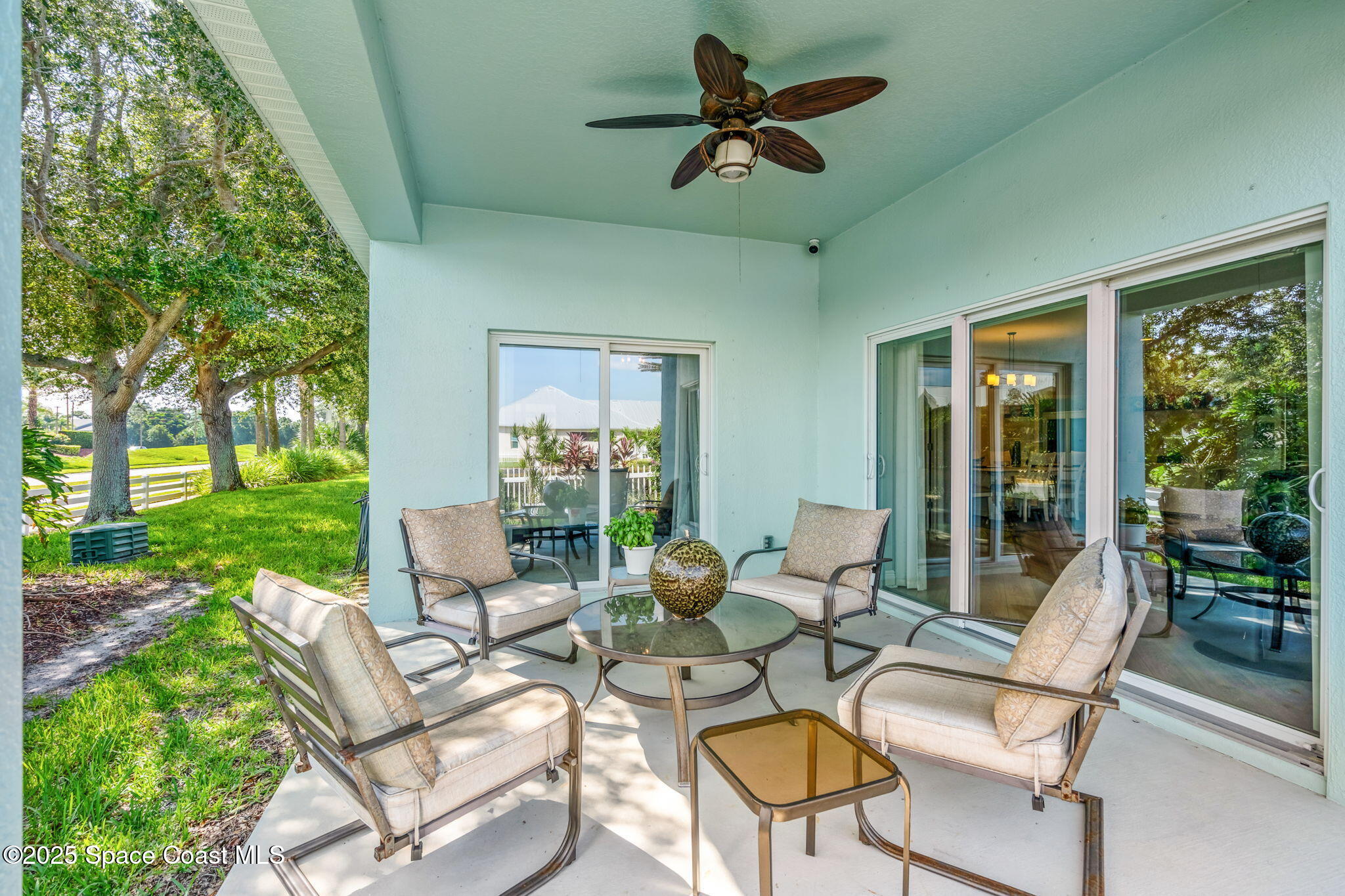4310 Alamanda Key Drive Melbourne, FL 32901 - Photo 25 of 43 a living room with patio furniture and garden