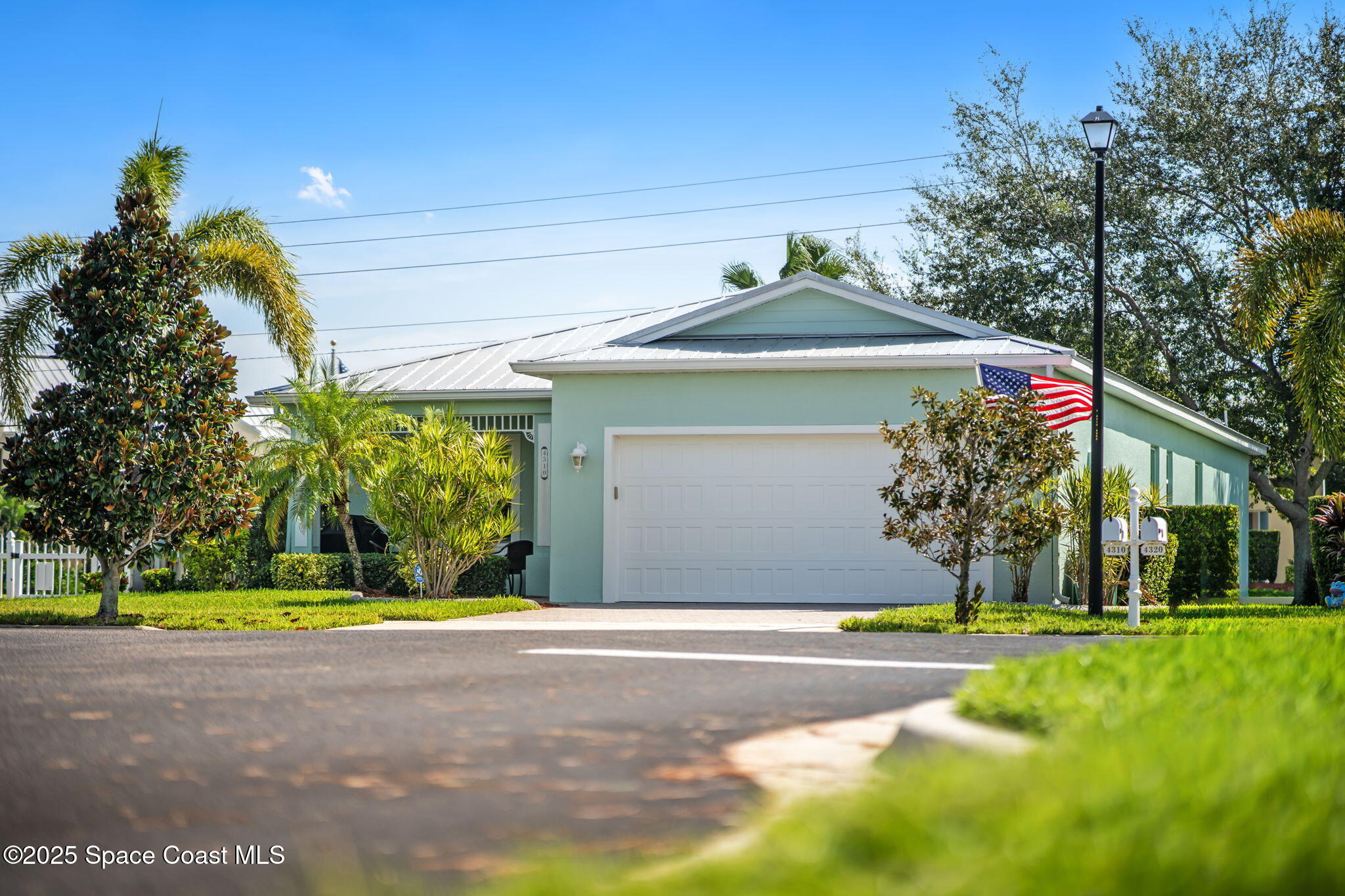 4310 Alamanda Key Drive Melbourne, FL 32901 - Photo 26 of 43 a front view of a house with a yard