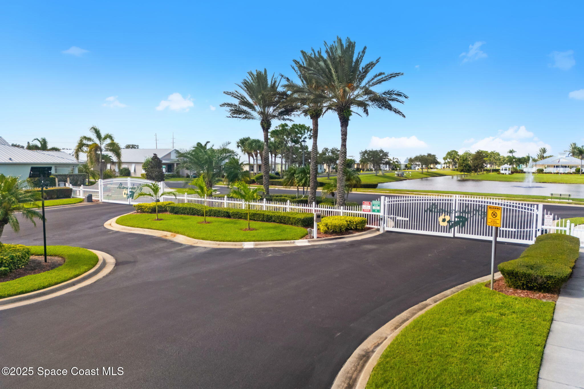 4310 Alamanda Key Drive Melbourne, FL 32901 - Photo 34 of 43 a view of a swimming pool with a table and chairs