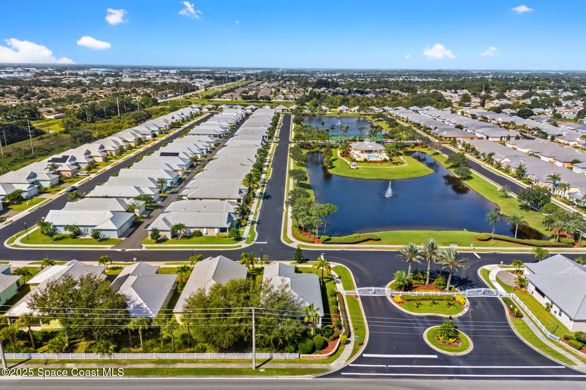 4310 Alamanda Key Drive Melbourne, FL 32901 - Photo 42 of 43 an aerial view of a swimming pool with lawn chairs