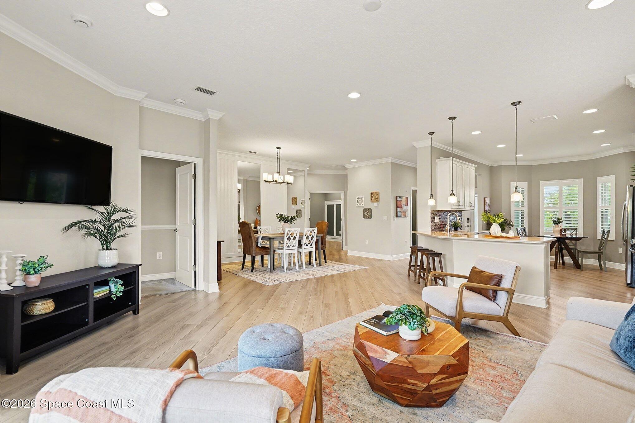 4310 Alamanda Key Drive Melbourne, FL 32901 - Photo 5 of 43 a living room with furniture and a flat screen tv