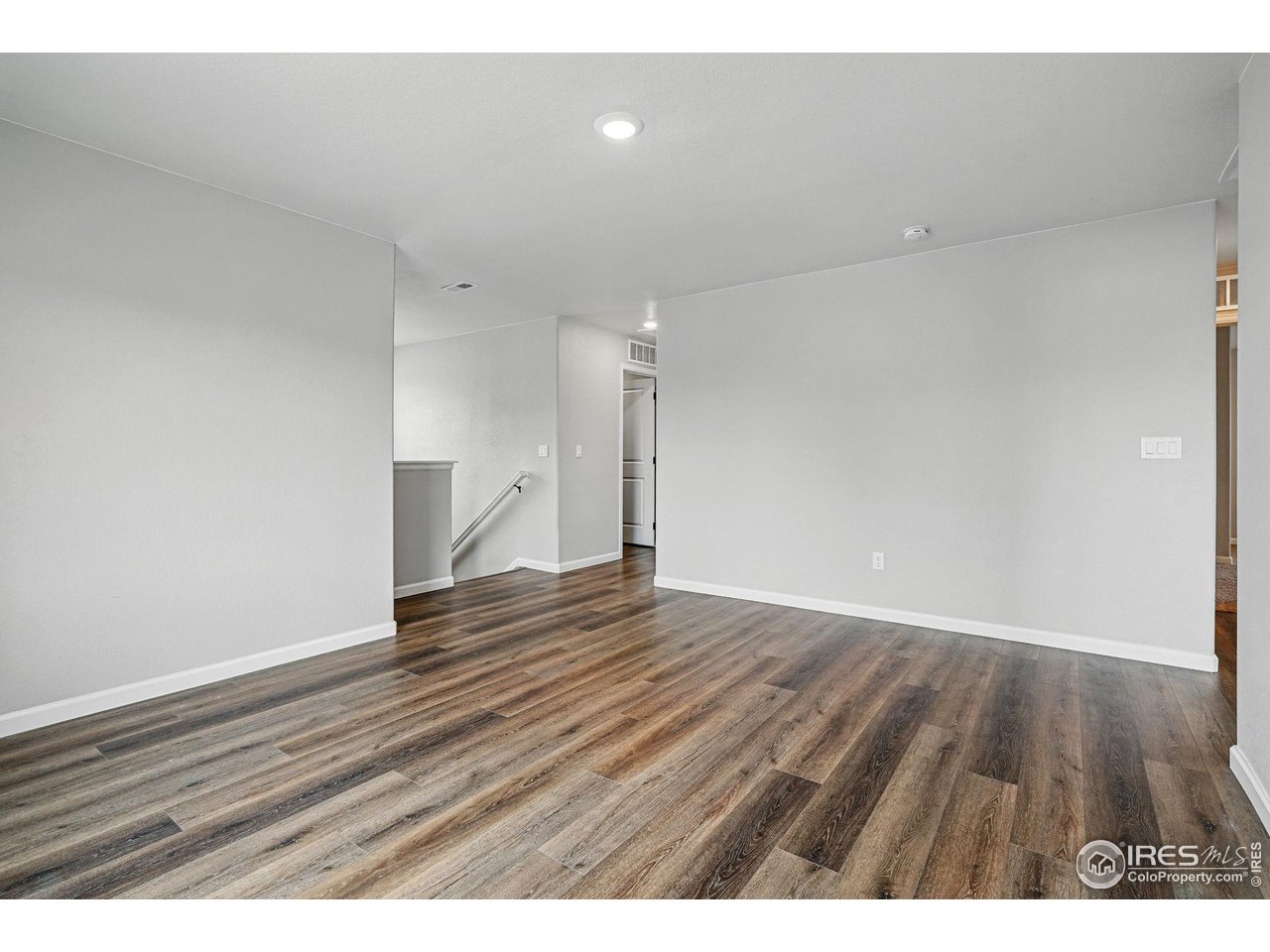 2310 Angus Street Mead, CO 80542 - Photo 20 of 39 a view of an empty room and wooden floor