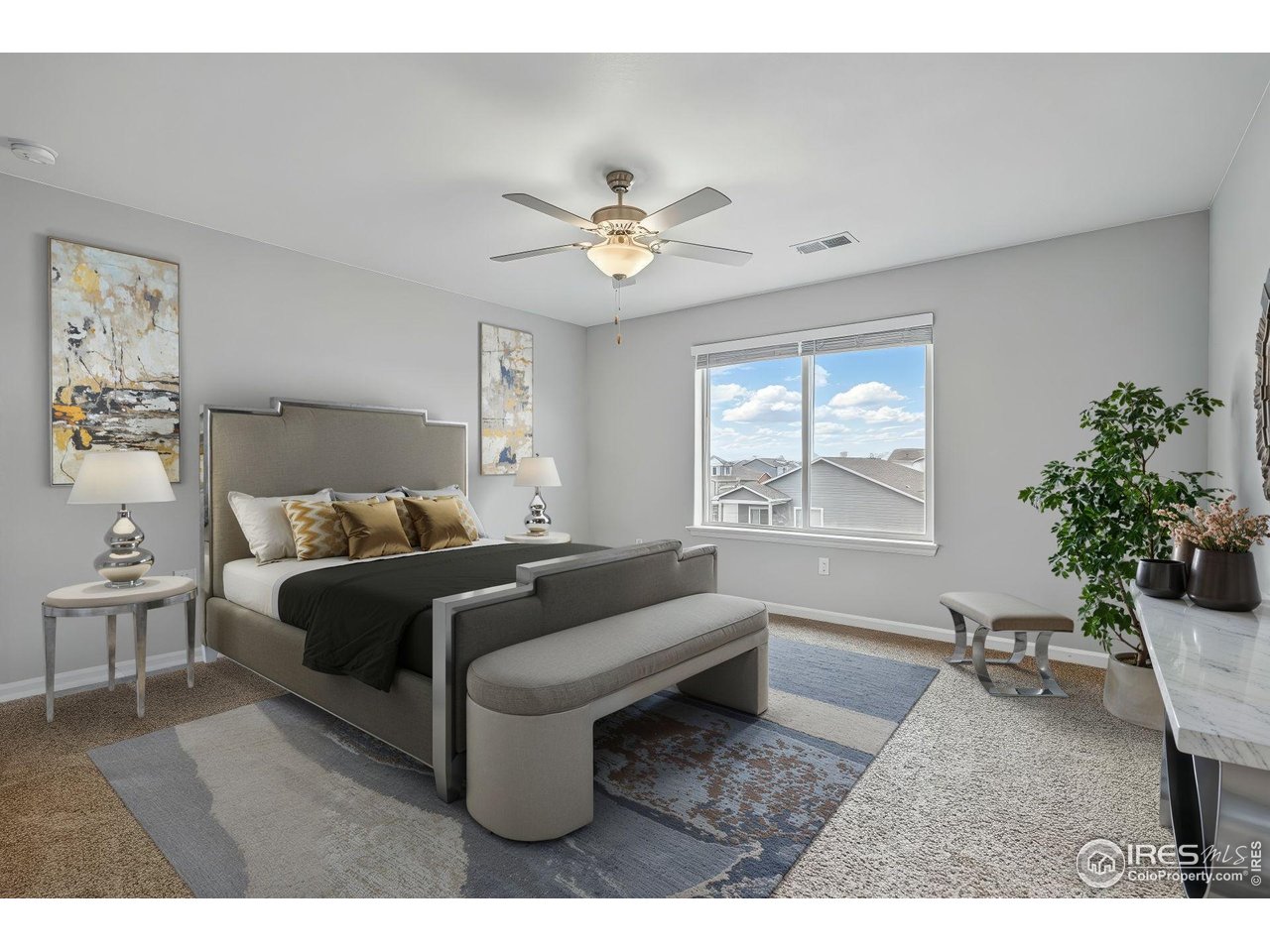 2310 Angus Street Mead, CO 80542 - Photo 21 of 39 a living room with furniture a chandelier and a window