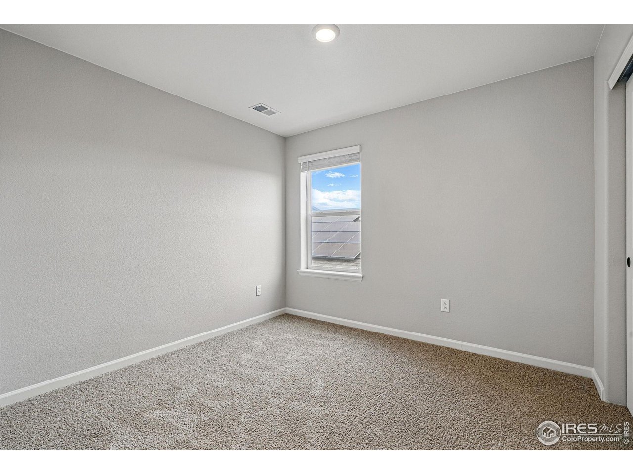 2310 Angus Street Mead, CO 80542 - Photo 27 of 39 a view of an empty room with a window