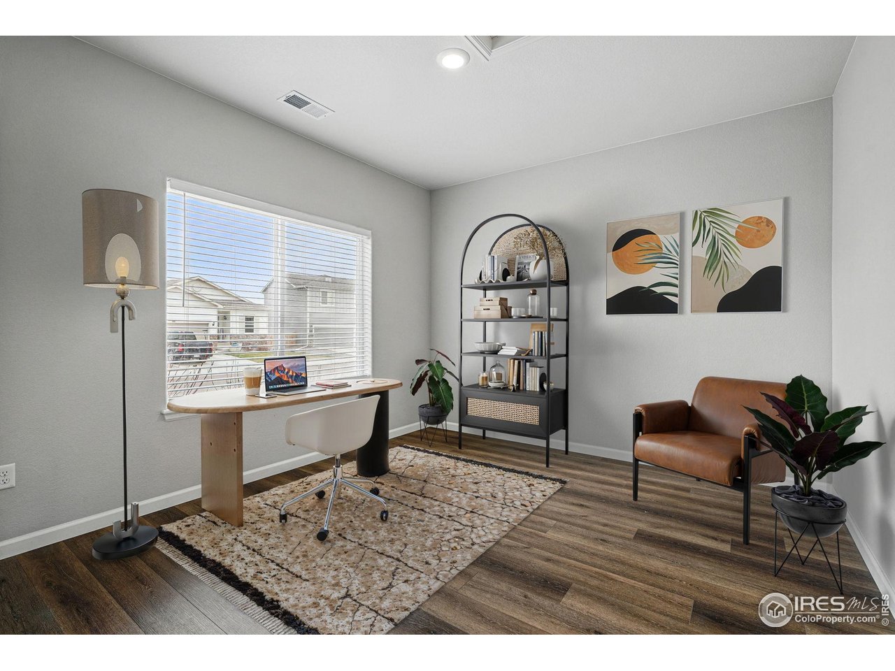 2310 Angus Street Mead, CO 80542 - Photo 4 of 39 a living room with furniture and wooden floor