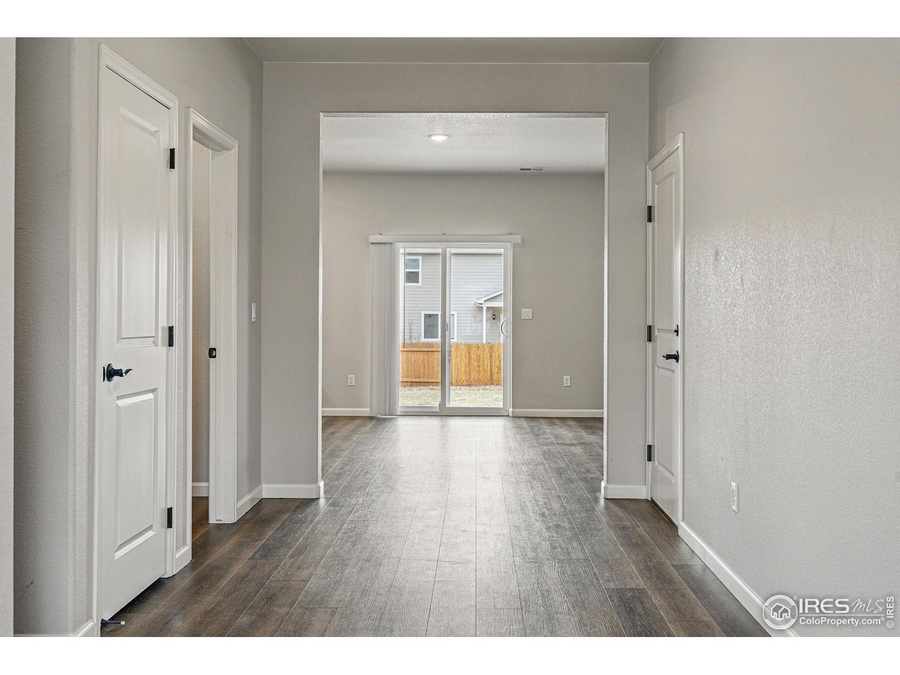 2310 Angus Street Mead, CO 80542 - Photo 7 of 39 a view of a hallway with wooden floor