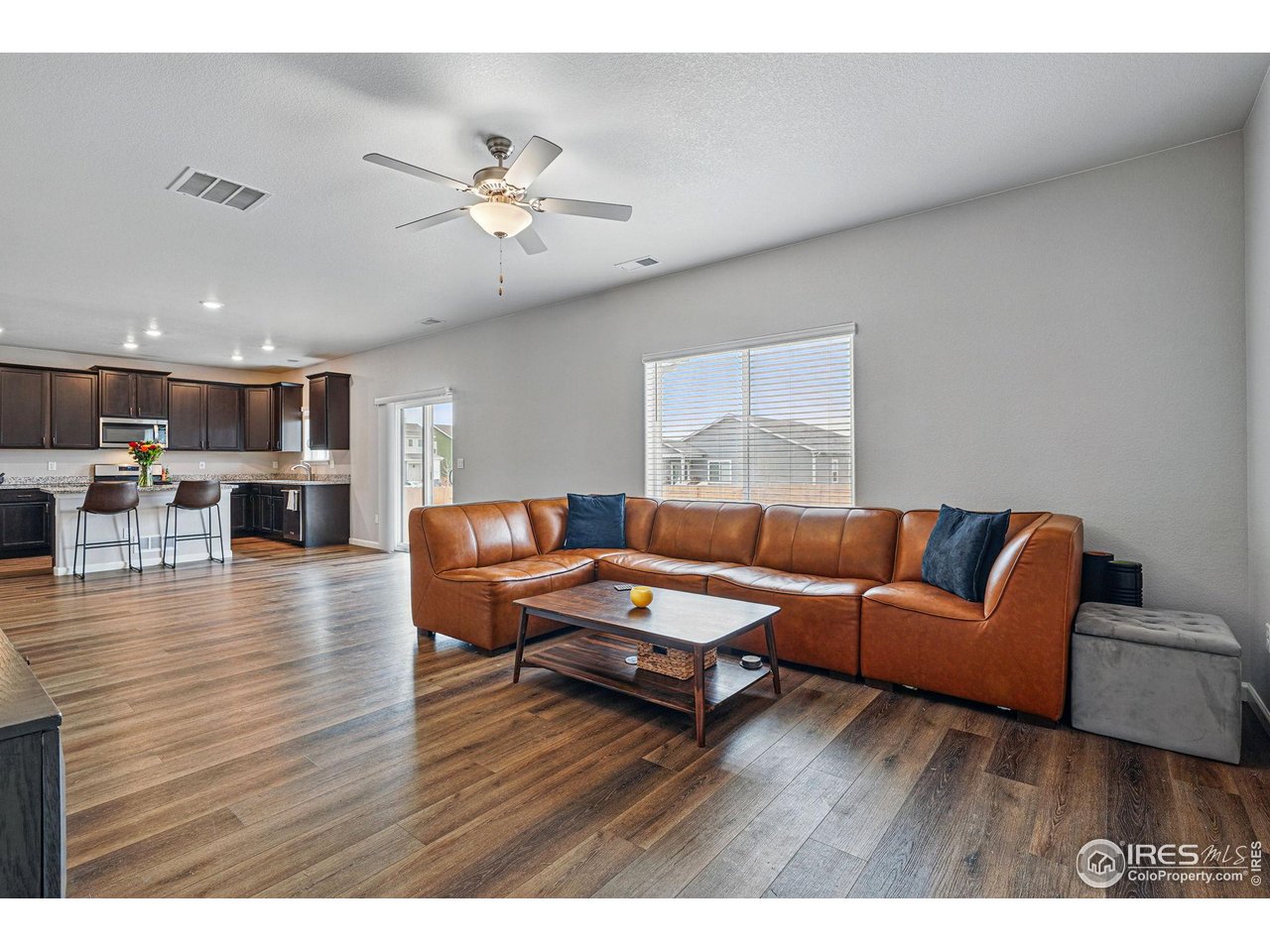2310 Angus Street Mead, CO 80542 - Photo 10 of 39 a living room with furniture and wooden floor