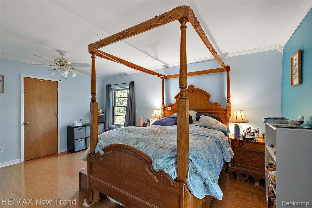 1450 Lenox Road Bloomfield Hills, MI 48304 - Photo 54 of 79 Wood-finish flooring, ceiling fan, and crown molding