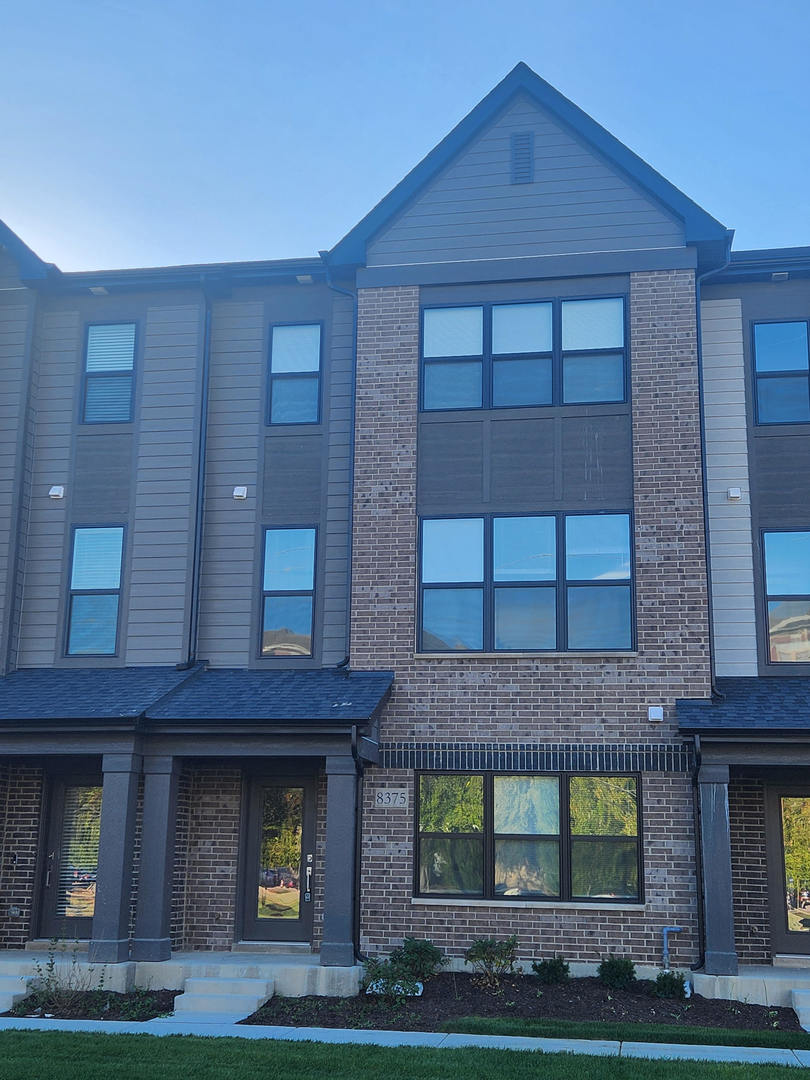 8375 Mulberry Avenue Morton Grove, IL 60053 - Photo 1 of 24 a front view of a building with garden