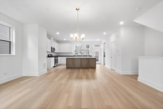 a view of kitchen with wooden floor and window