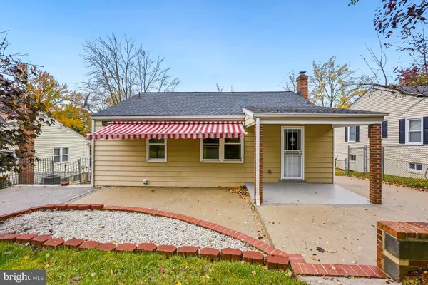 front view of a house with a chair