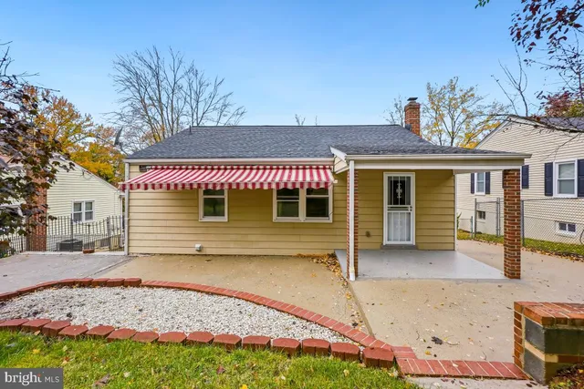 front view of a house with a chair