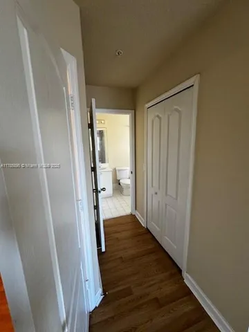 a view of a bathroom from a hallway