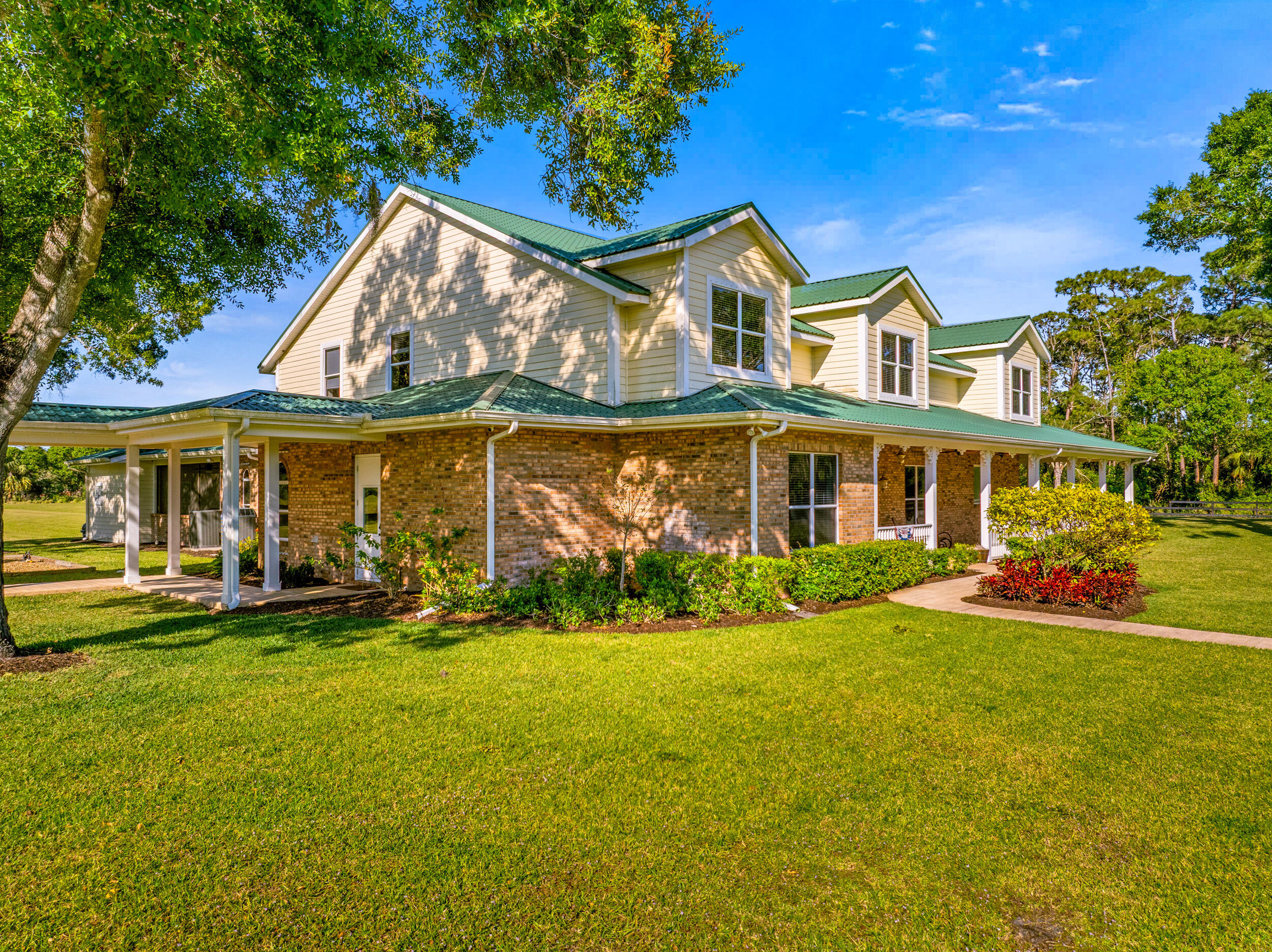 8686 Andrews Avenue Fort Pierce, FL 34945 - Photo 8 of 76 a view of a house with swimming pool and sitting area