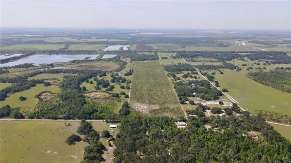 an aerial view of a house with a lake view