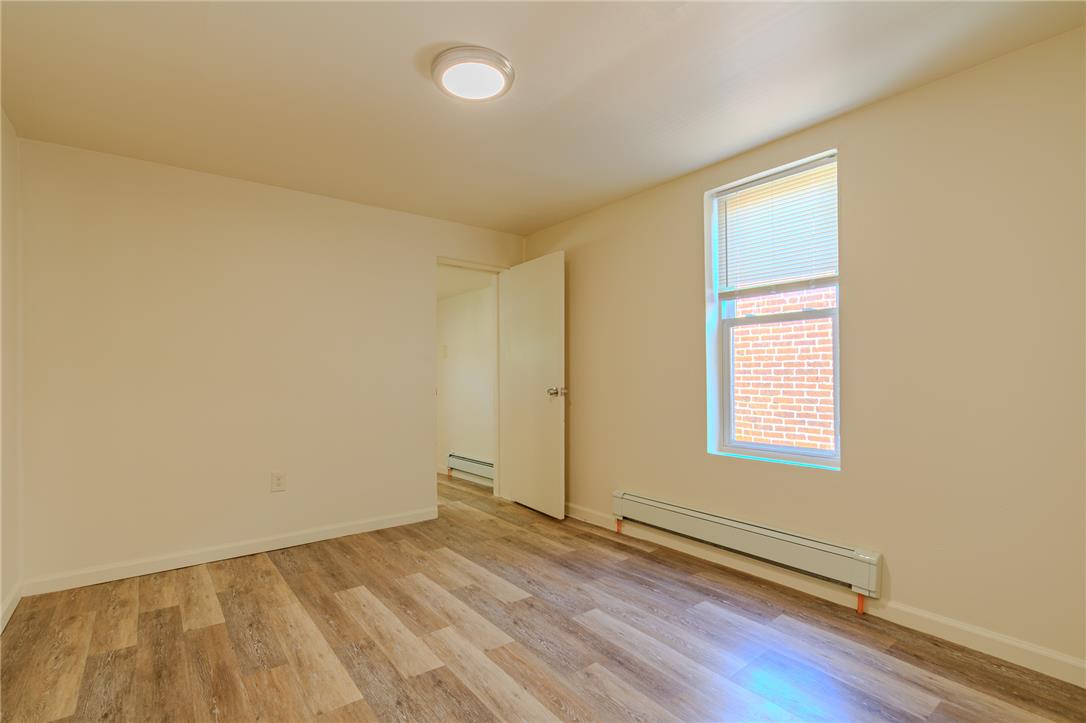 820 North 5th Street Allentown, PA 18102 - Photo 25 of 39 A well-proportioned bedroom with resilient flooring and a naturally illuminated window.