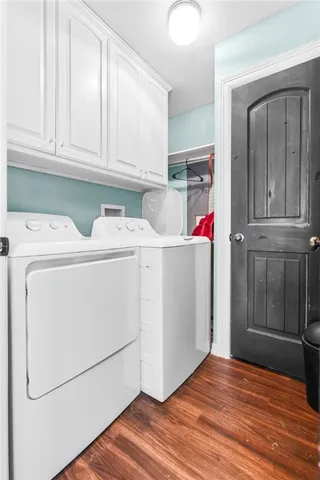 a view of a storage and utility room with washer and dryer