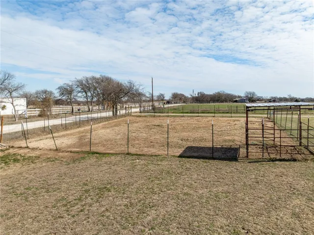 a view of lawn chairs and lake view