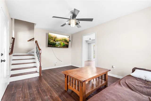 a living room with furniture and a flat screen tv