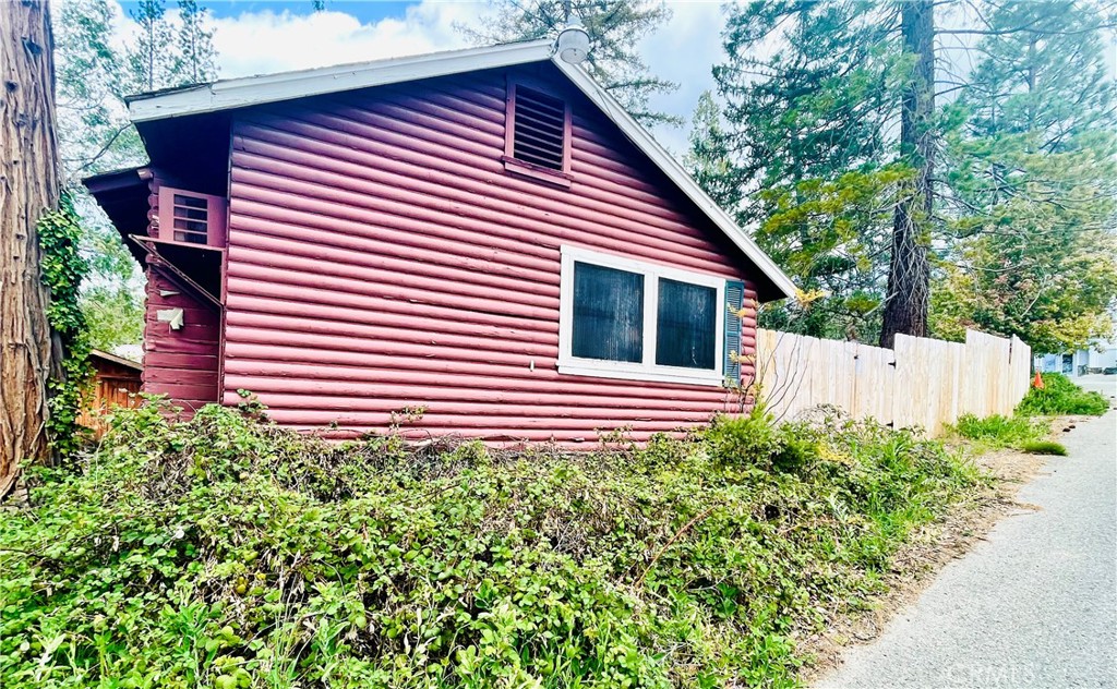 39550 Saunders Bass Lake, CA 93604 - Photo 3 of 30 a view of a house with a small yard and plants