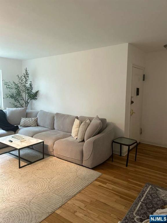 1480 Terrace, Unit 4 Teaneck, NJ 07666 - Photo 3 of 14 a living room with furniture and a wooden floor