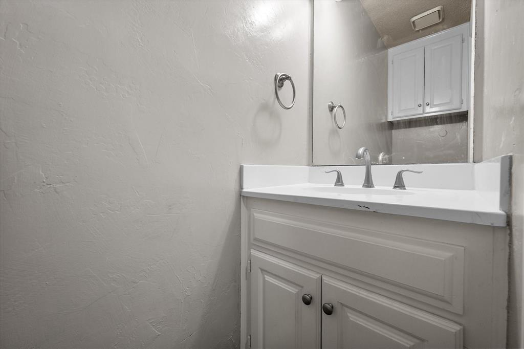 2312 Perkins Road Arlington, TX 76016 - Photo 19 of 37 a bathroom with a sink and a mirror