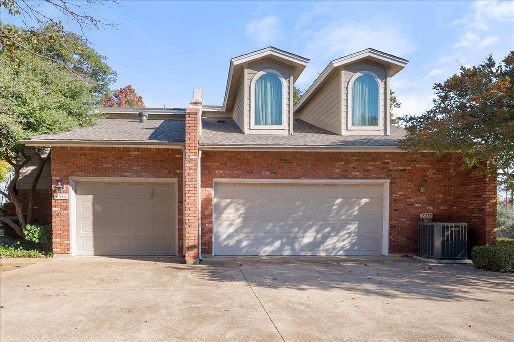 2312 Perkins Road Arlington, TX 76016 - Photo 2 of 37 a front view of a house with a yard and garage
