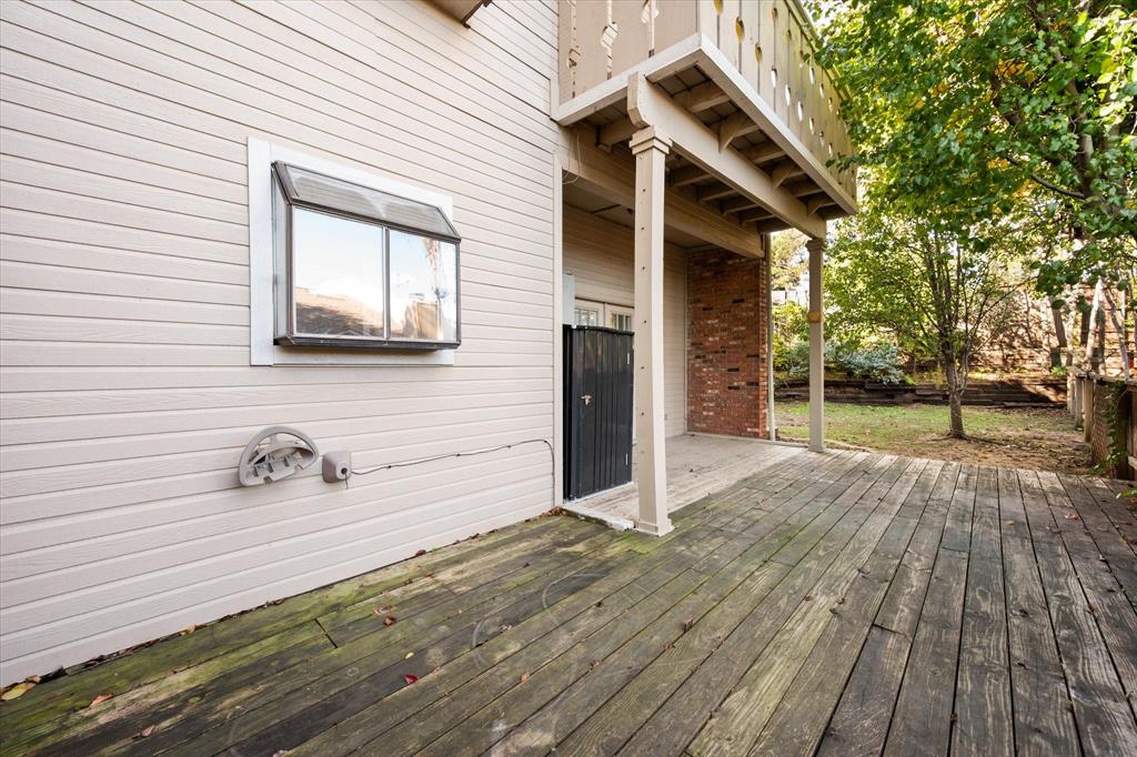 2312 Perkins Road Arlington, TX 76016 - Photo 30 of 37 Large Side Deck Balcony off Primary Bedroom. Check out the Garden Window in the Kitchen