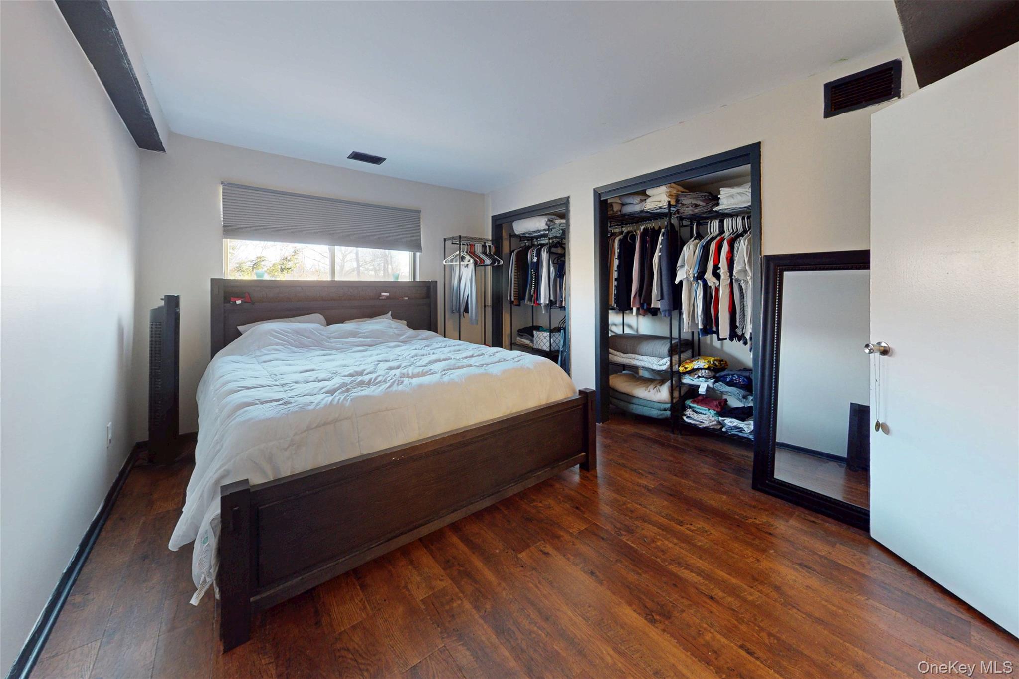 26 Cooper Road, Unit 914 Poughkeepsie, NY 12603 - Photo 12 of 19 Bedroom featuring multiple closets and luxury laminate floors