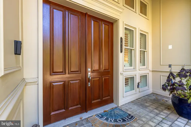 a view of entryway with furniture and flower pot