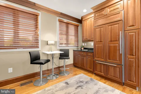 a kitchen with granite countertop cabinets furniture and a window