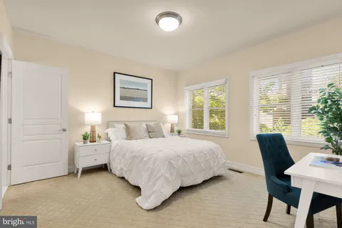 a bedroom with a bed and a table