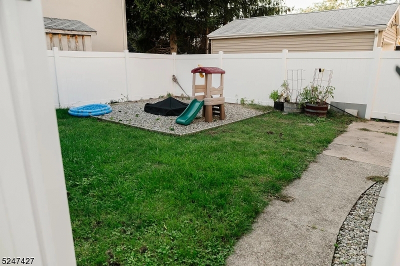 554 Second Avenue, Unit 1 Lyndhurst, NJ 07071 - Photo 7 of 11 a front view of a house with garden