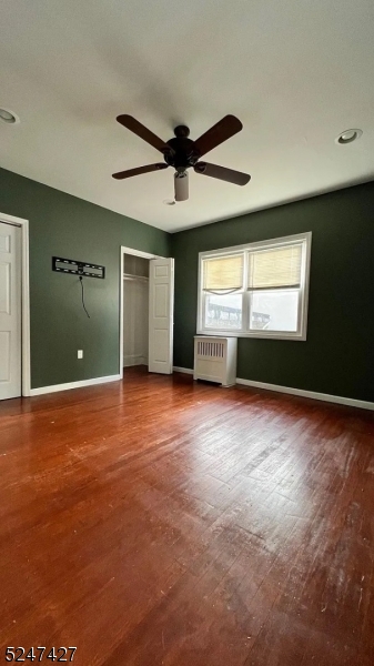 554 Second Avenue, Unit 1 Lyndhurst, NJ 07071 - Photo 8 of 11 a view of empty room with windows and ceiling fan