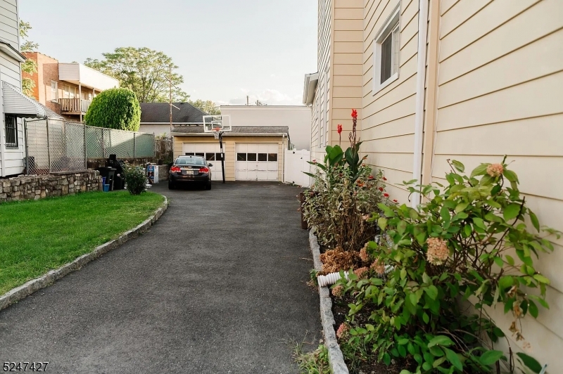 554 Second Avenue, Unit 1 Lyndhurst, NJ 07071 - Photo 9 of 11 a view of a house with a cars park
