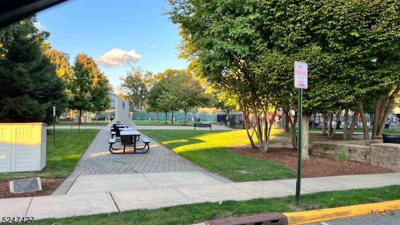 554 Second Avenue, Unit 1 Lyndhurst, NJ 07071 - Photo 10 of 11 a view of a swimming pool with a bench and a yard