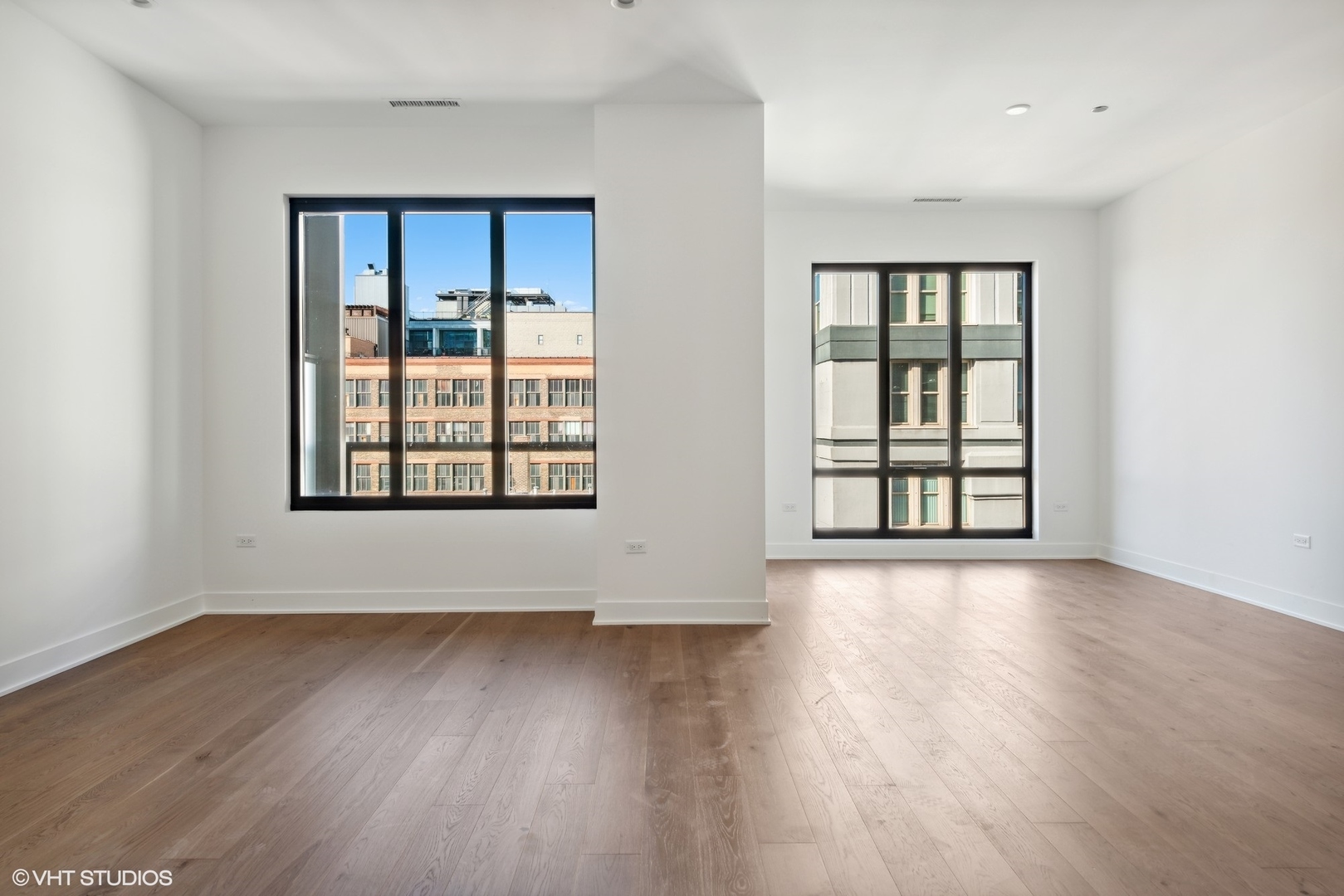 323 South Racine Avenue, Unit 6B Chicago, IL 60607 - Photo 24 of 36 an empty room with wooden floor and windows