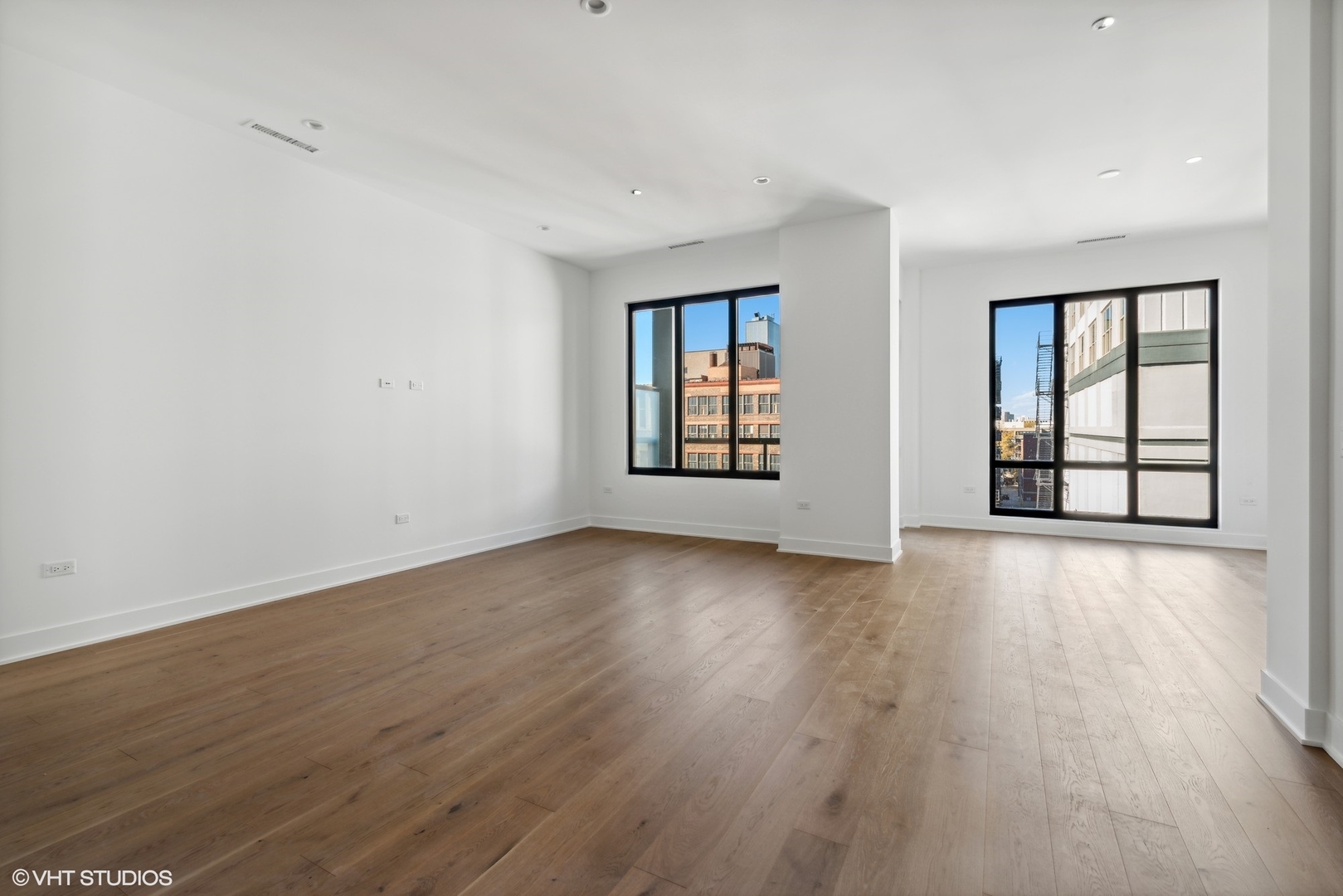 323 South Racine Avenue, Unit 6B Chicago, IL 60607 - Photo 25 of 36 an empty room with wooden floor and windows