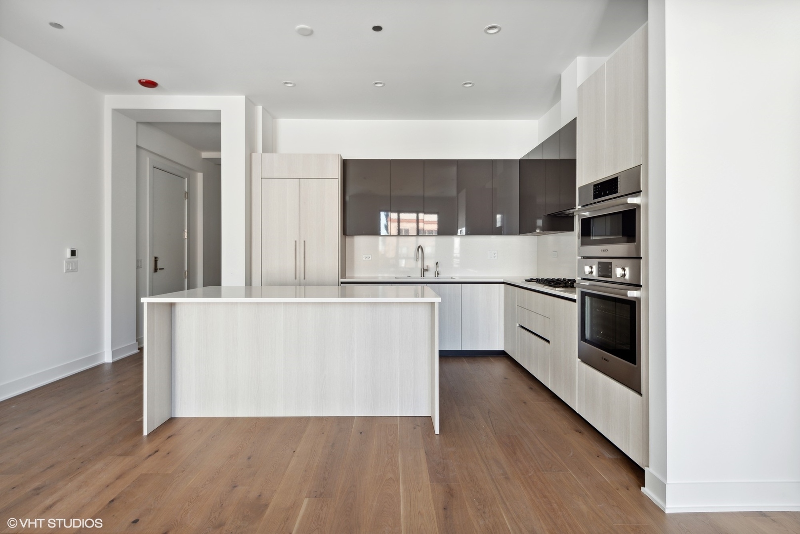 323 South Racine Avenue, Unit 6B Chicago, IL 60607 - Photo 29 of 36 a kitchen with stainless steel appliances a sink and a refrigerator