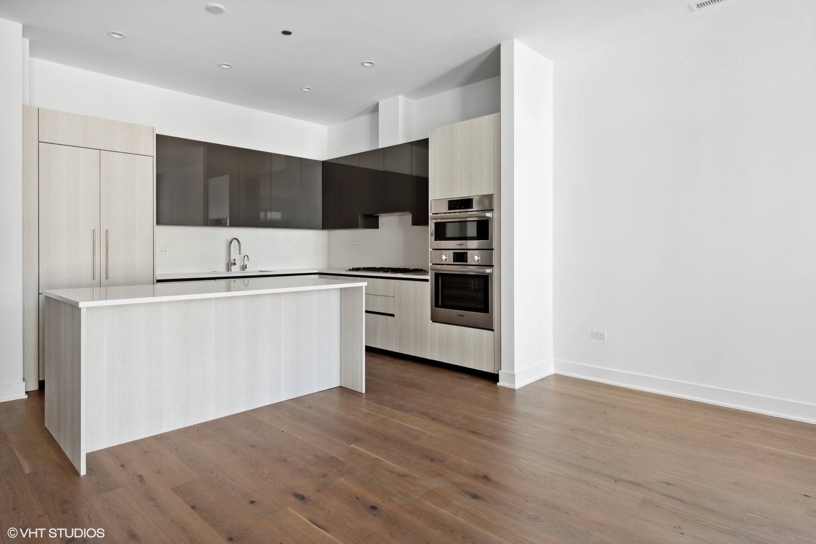 323 South Racine Avenue, Unit 6B Chicago, IL 60607 - Photo 30 of 36 a kitchen with stainless steel appliances a refrigerator and a stove top oven