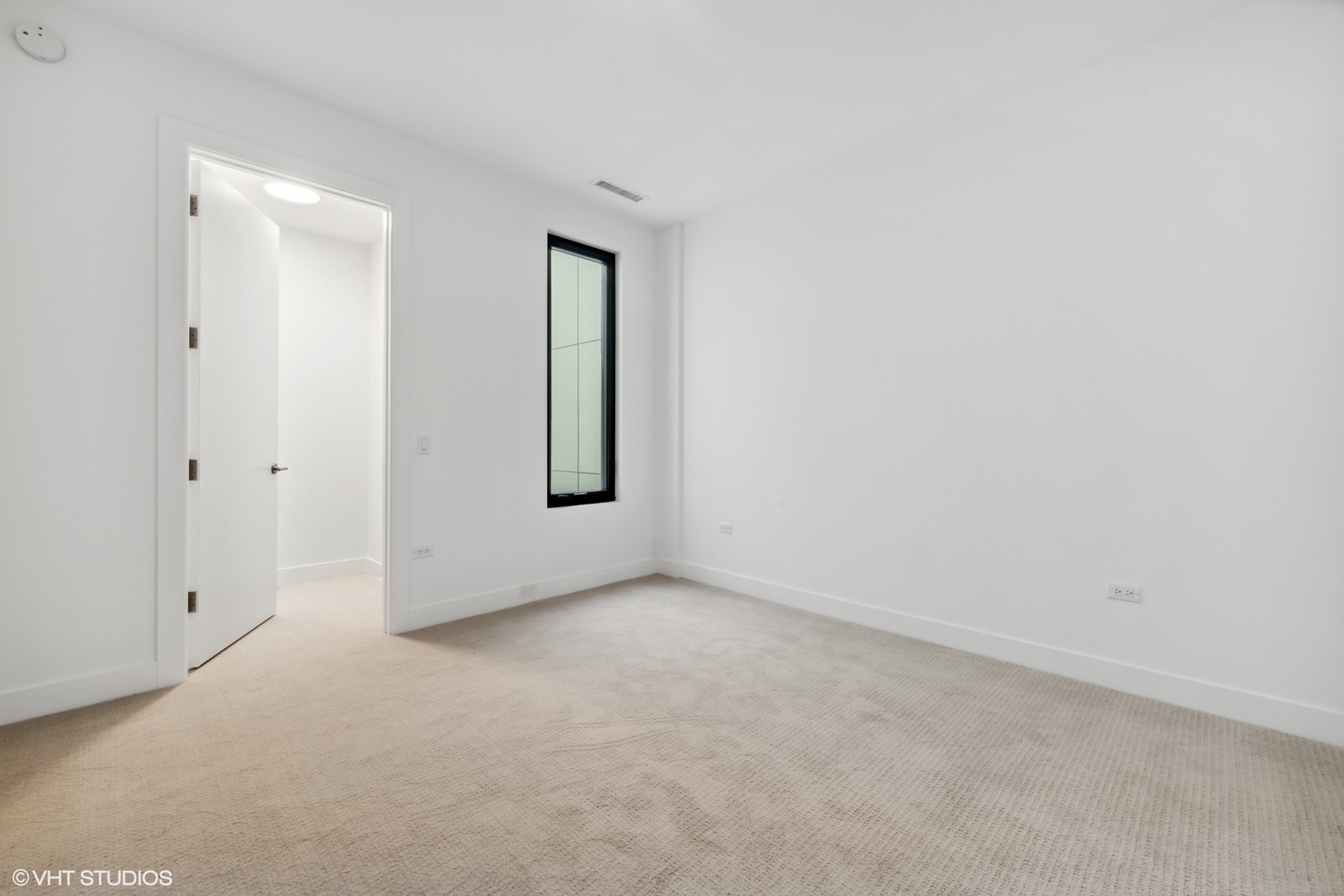 323 South Racine Avenue, Unit 6B Chicago, IL 60607 - Photo 35 of 36 a view of an empty room and window