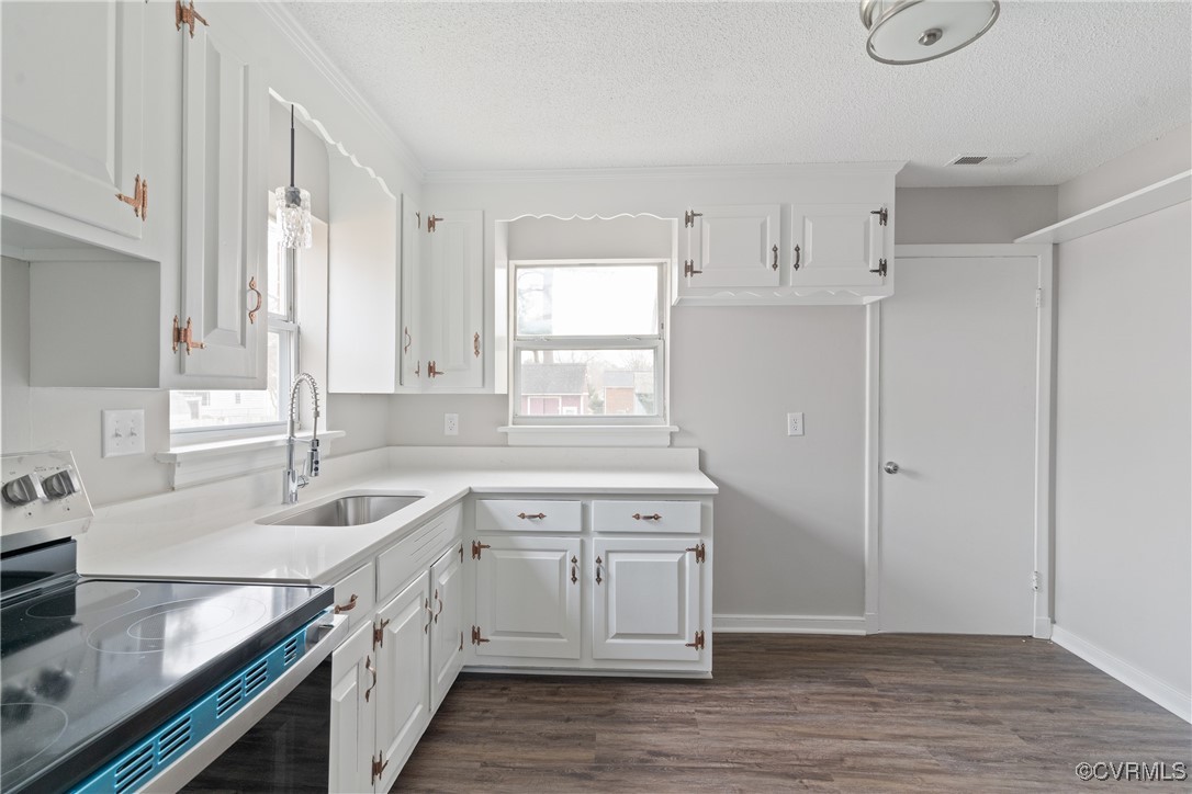 404 Beulah Road Sandston, VA 23150 - Photo 4 of 19 Kitchen featuring white cabinetry, and range with